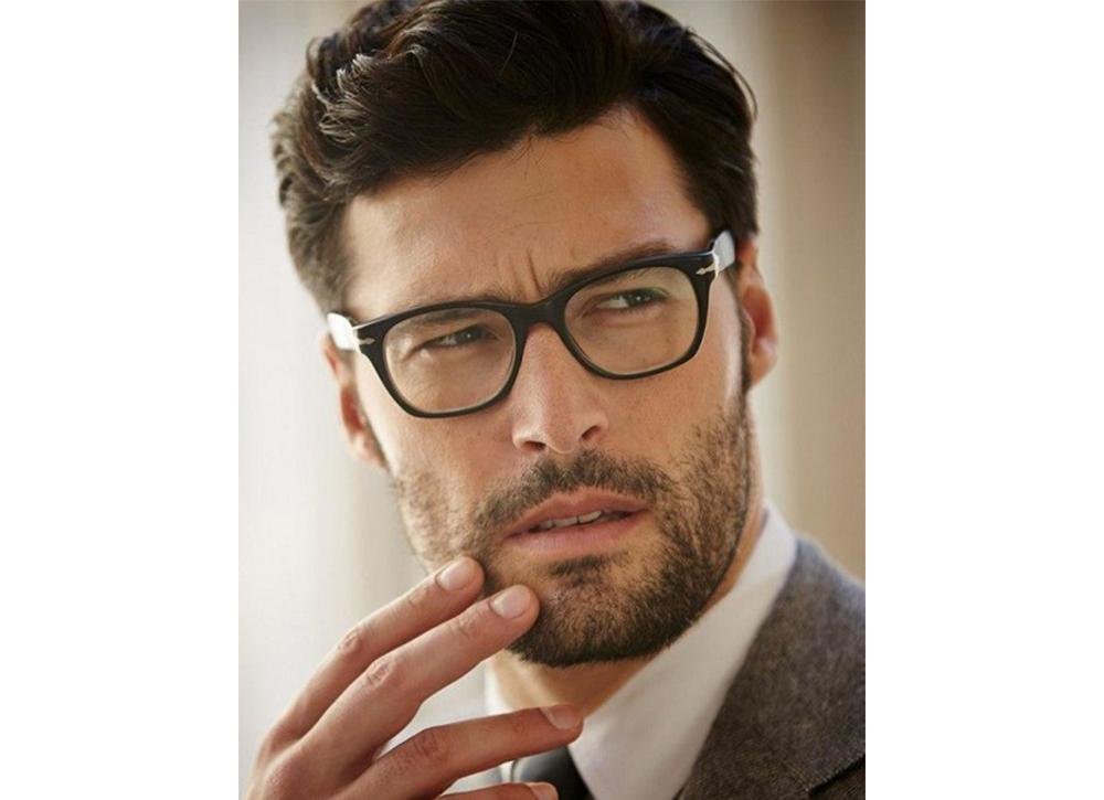 What are some types of hairstyles that suit a male with an oval face wearing glasses